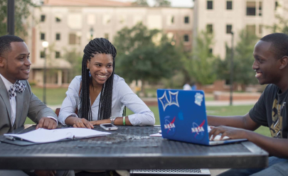 asu students working on a laptop on campus